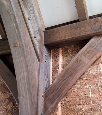 Timber Frame Post, Beam and Cross Brace Junction Detail in strawbale home