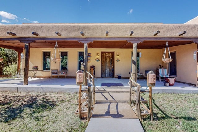 Strawbales house for sale in New Mexico, front porch with entry bridge
