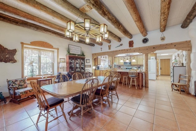Strawbales house for sale in NM, kitchen with tiled floor and beam details