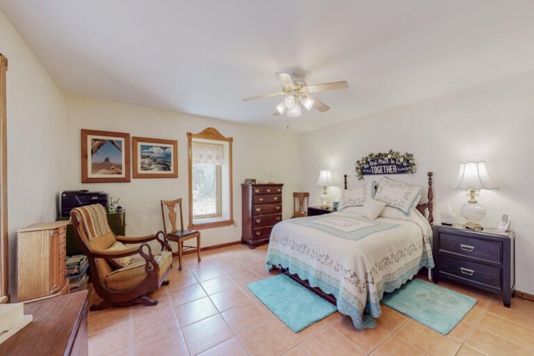 Strawbales house for sale in New Mexico, bedroom with tile and window