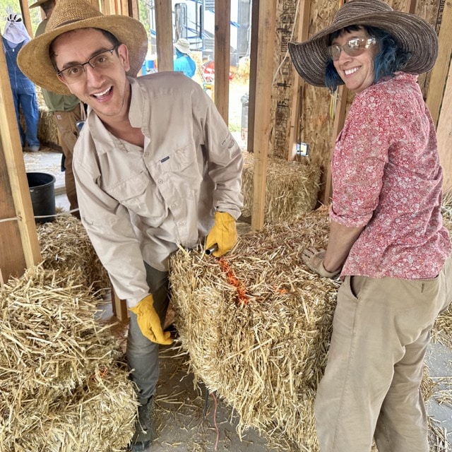 big smiles and laughs while resizing bales