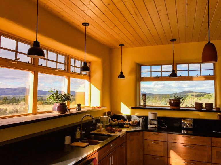 kitchen with stem wall, bale windows, finished straw bale home