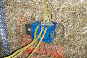 Electrical box and wires in straw bale wall