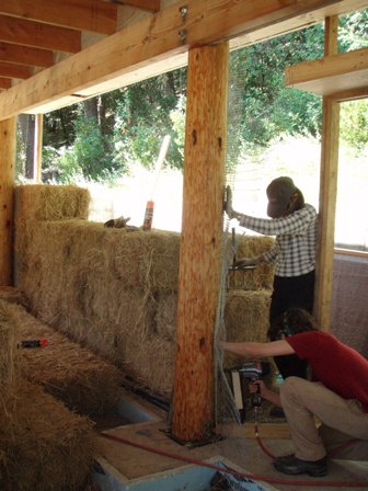 applying welded wire mesh to straw bale wall