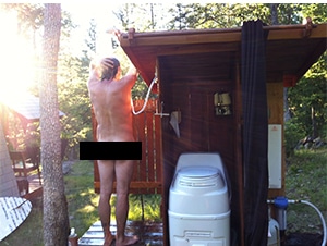 Man Using Outdoor Shower