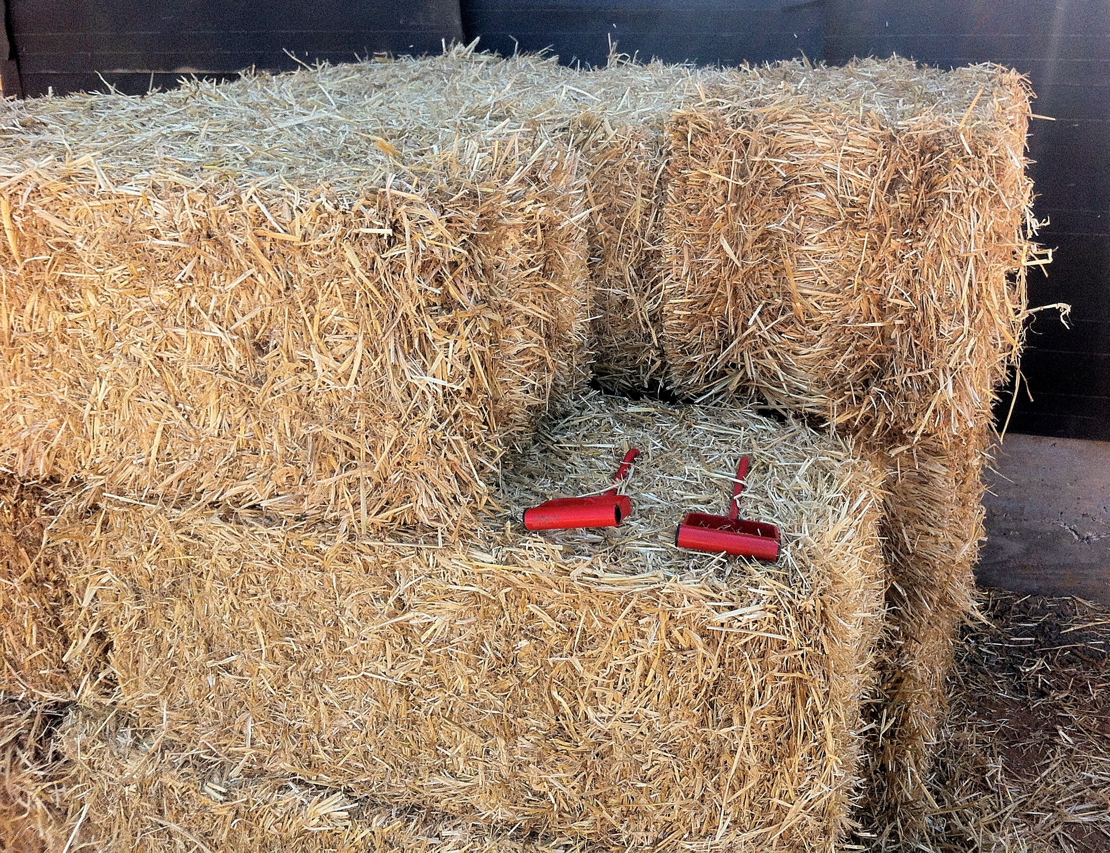 straw bale stack with hook tools, straw bale house calculator